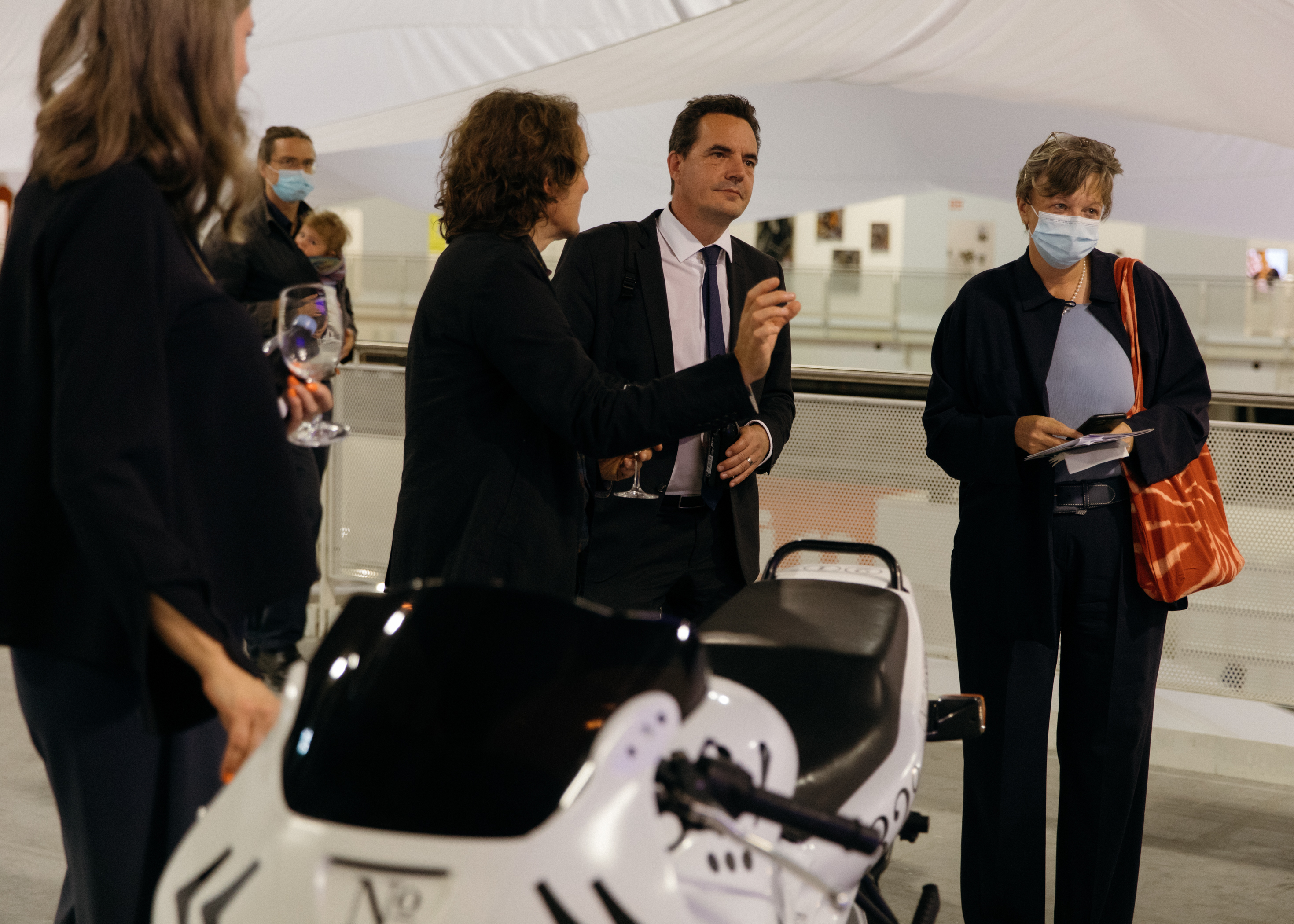 Swiss Design Awards cocktail. Jörg Boner gives a tour to Isabelle Chassot