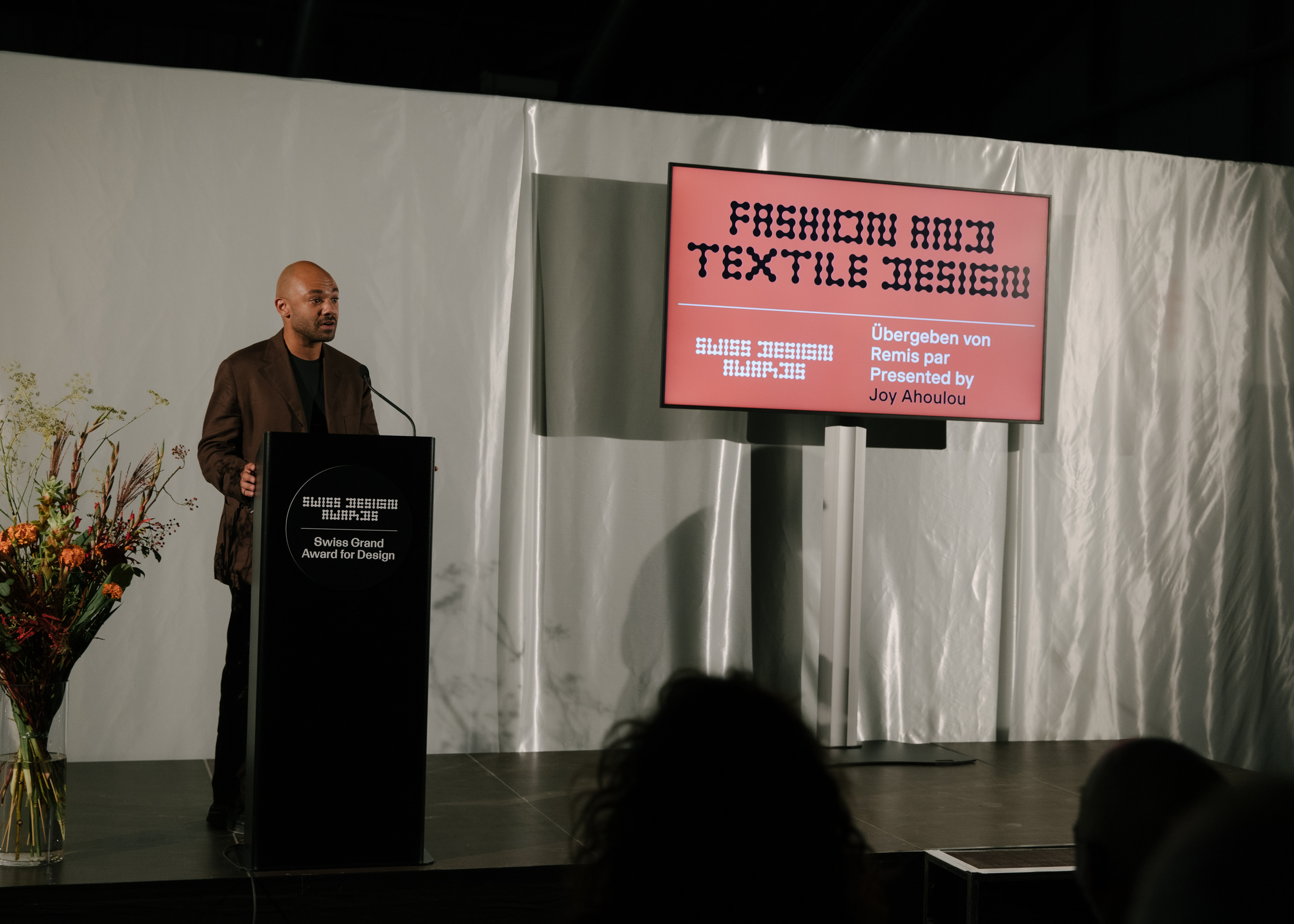 Swiss Design Awards ceremony. Joy Ahoulou presenting the winners of the Fashion and Textile Design category